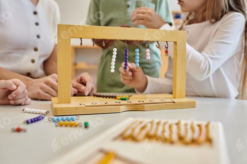 Preview: Hanger for color bead stairs, montessori concept, cropped view of kids playing game near teacher