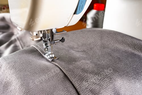 Preview: Modern sewing machine and gray fabric. Sewing process, handmade, hobby, DIY, business, repair