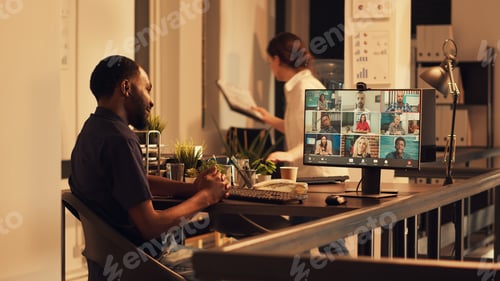 Visualização: African american freelancer attending videocall corporate meeting
