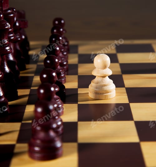 Preview: Playing chess game with black and white pieces on wooden board