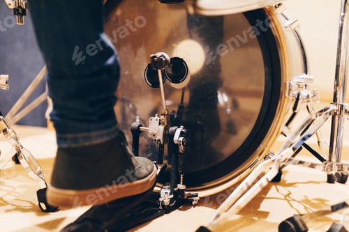 Preview: Man playing on drum pedal