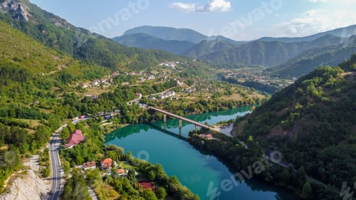 Preview: Scenic view of a road passing through a majestic gorge, with a bridge in the distance in Bosnia