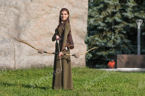 Preview: Girl with bow and arrow in green suit