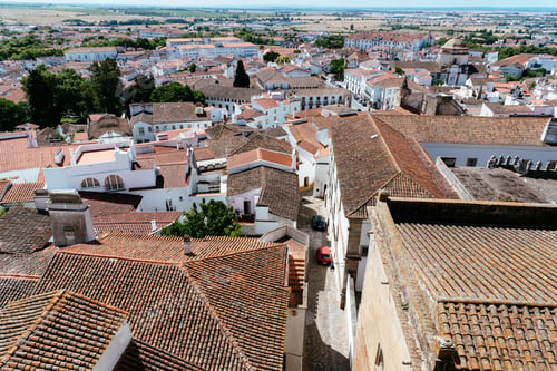 Preview: Cityscape of Evora with typical houses painted in white and ceramic tiled roofs