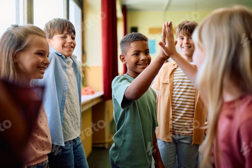 Preview: Happy kids greeting in the classroom at school.