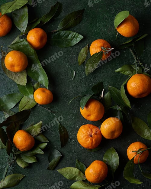 Preview: Tangerines on a green background, top view