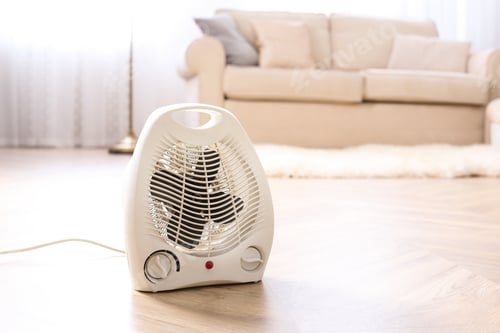 Preview: Modern electric fan heater on floor at home
