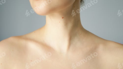 Preview: Skin in collarbone area with brown mole and nevus