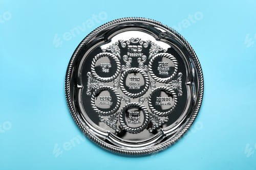 Preview: Empty traditional Passover (Pesach) Seder plate on color background, top view