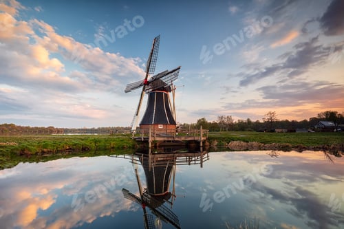 Preview: windmill and sky reflected in water