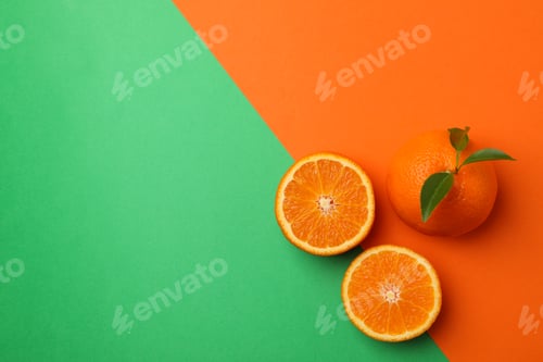 Preview: Ripe mandarins on two tone background, top view
