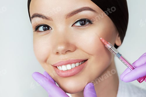 Preview: Beautiful Asian woman gets beauty injections. Close-up injection of anti-aging and wrinkle perfect