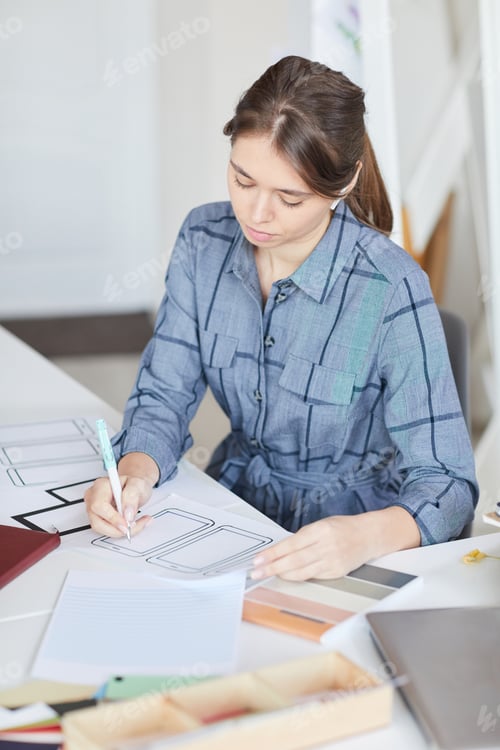 Preview: Girl concentrated on ui design