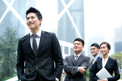 Preview: Cheerful Chinese businessman with his team in Hong Kong