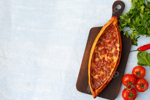 Preview: Turkish baked Pide bread on light blue wooden surface