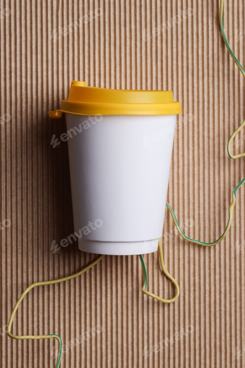 Preview: White blank takeaway paper recycle cup with yellow lid on brown ribbed background , mock up