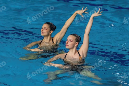 Preview: Synchronized swimming duet dance. Synchronized swimming duet enchants the pool