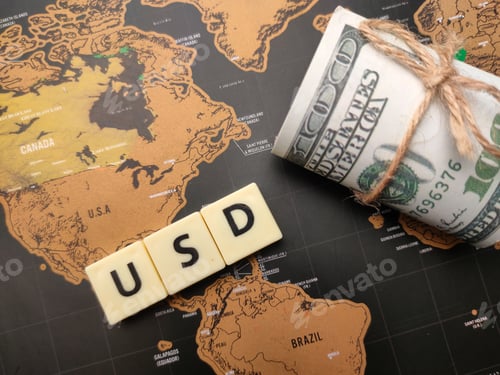 Preview: Top view toys word and banknotes with the word USD.