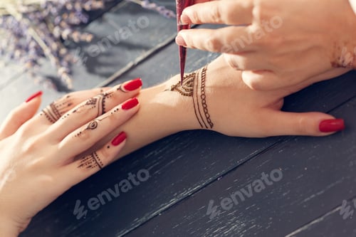 Preview: Process of applying mehndi on female hands