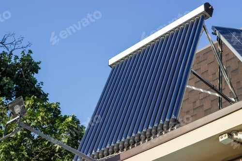 Preview: Domestic solar panel on a roof, with clear, cloudless sky