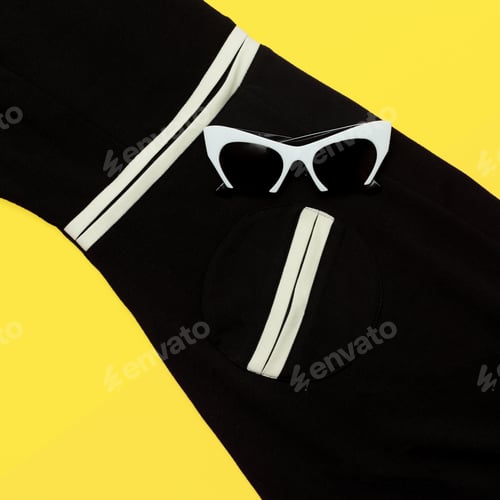 Preview: Stylish Sunglasses and Outfit on Yellow Background