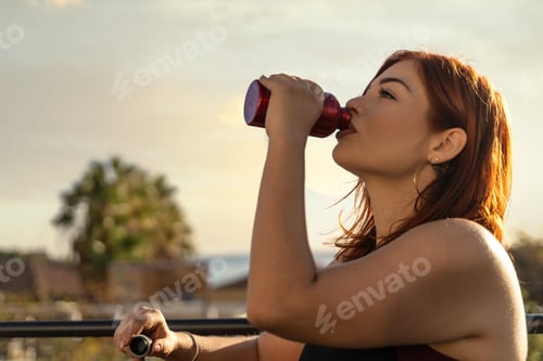 Preview: Active Woman Hydrating with Juice After Workout