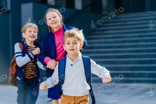 Preview: Smiling children. Joyful school girl and two boys.
