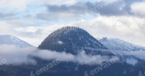 Preview: Snow and Cloud covered Canadian Nature Landscape Background