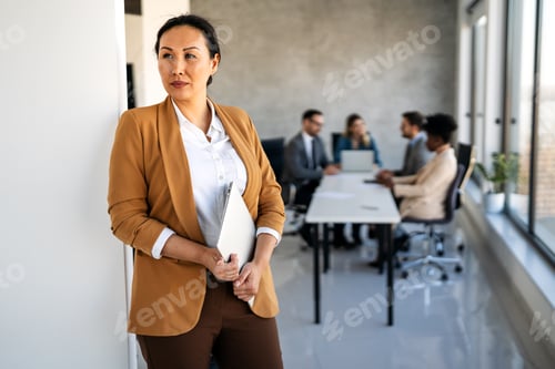 Preview: Young happy successful business woman working in corporate office