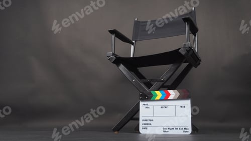Preview: Black director chair and Clapper board on black background.