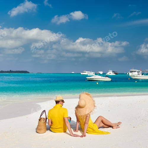 Preview: Couple In Yellow On Tropical Beach. Summer Vacation At Maldives.