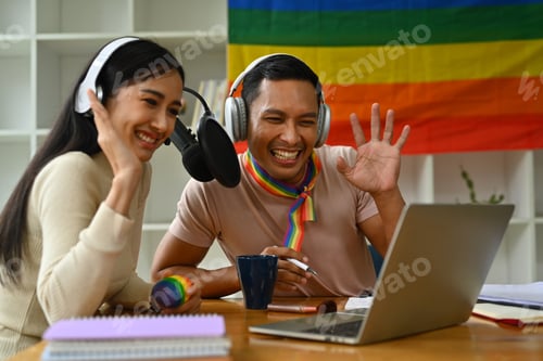 Preview: Cheerful young woman and biracial transgender man recording podcast from home studio.