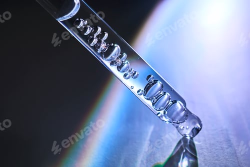 Preview: Pipette with serum in a space atmosphere.