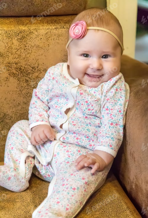 Preview: The baby is 4 months old and is being played. Selective focus.