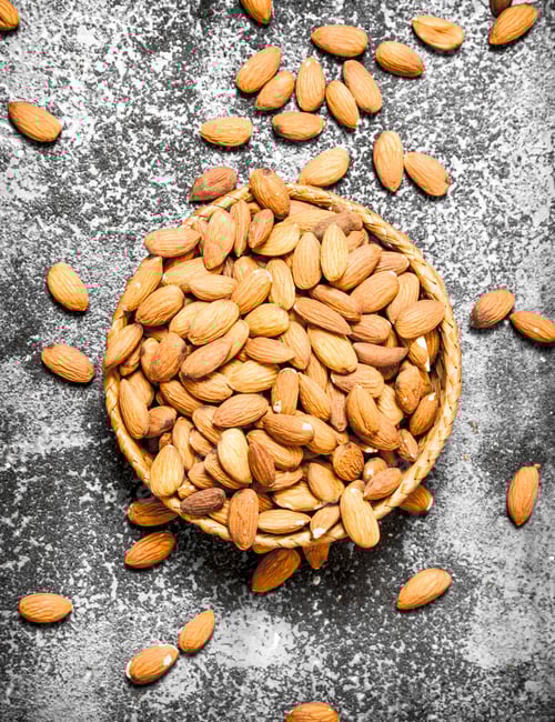 Preview: Basket of Almonds on Textured Gray Surface