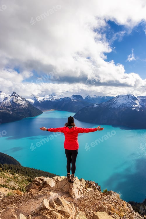 Preview: Adventurous Caucasian Woman hiking on top of a Canadian mountain