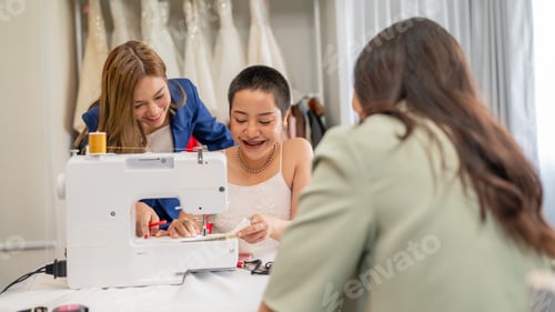 Preview: Fashion design concept, young stylish woman fashion designer working in studio.
