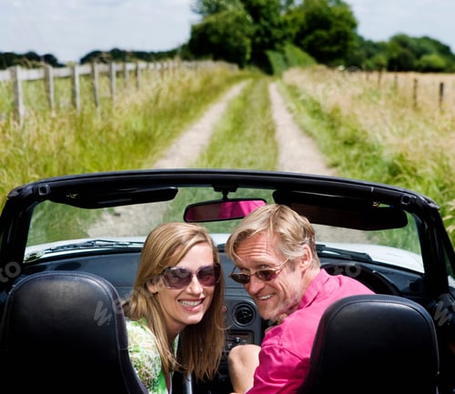 Preview: Couple in convertible car