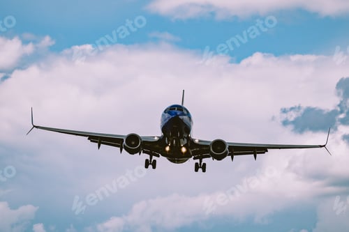Preview: Beautiful view of an airplane flying in a cloudy sky
