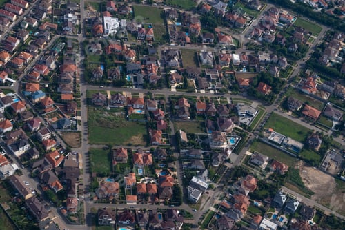 Preview: Residential area, rooftops, view from a drone. Cottages in the village. Land view through the