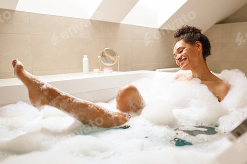 Preview: A young woman is happily bathing in a bathtub