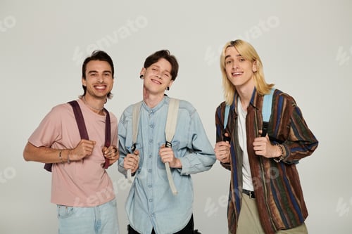 Preview: Three queer students pose with backpacks