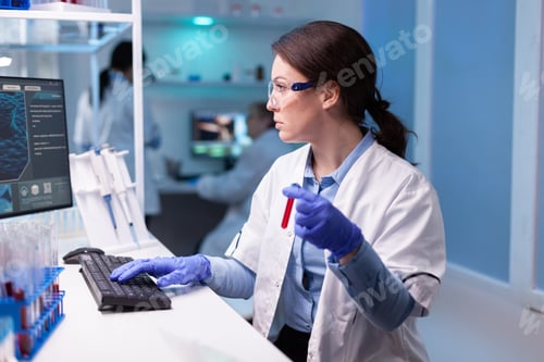 Preview: Professional doctor scientist taking a sample for medical experiment