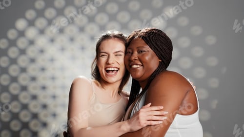 Preview: Happy glowing girls laughing and posing in studio