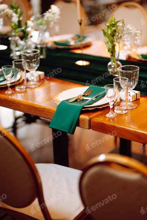 Preview: Banquet table in the restaurant, preparation before the banquet. The work of professional florists.