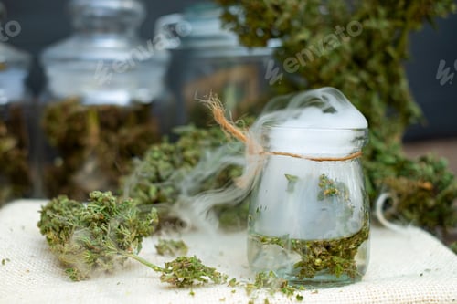 Preview: Green Herbs in Glass Jar with White Smoke