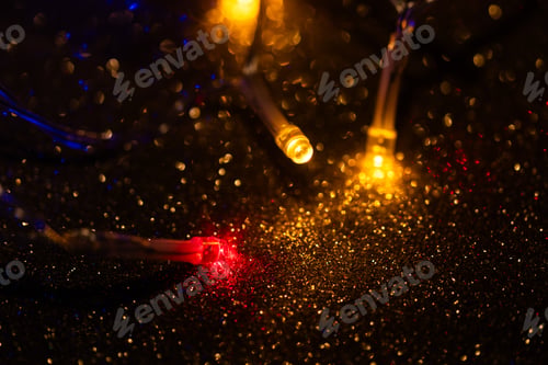 Preview: colorful Christmas lights on dark glitter background