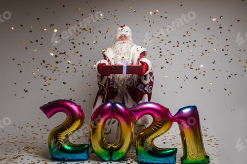 Preview: father frost with baloons with numbers 2021 holds a gift