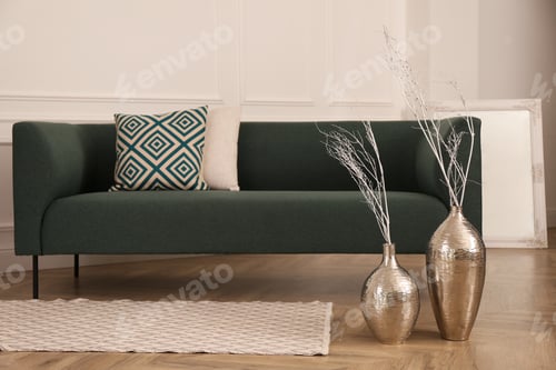 Preview: Metal vases with white tree twigs on floor near sofa in living room