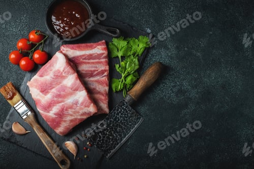 Preview: Raw meat. Raw pork ribs from the back with meat on a black background. background image